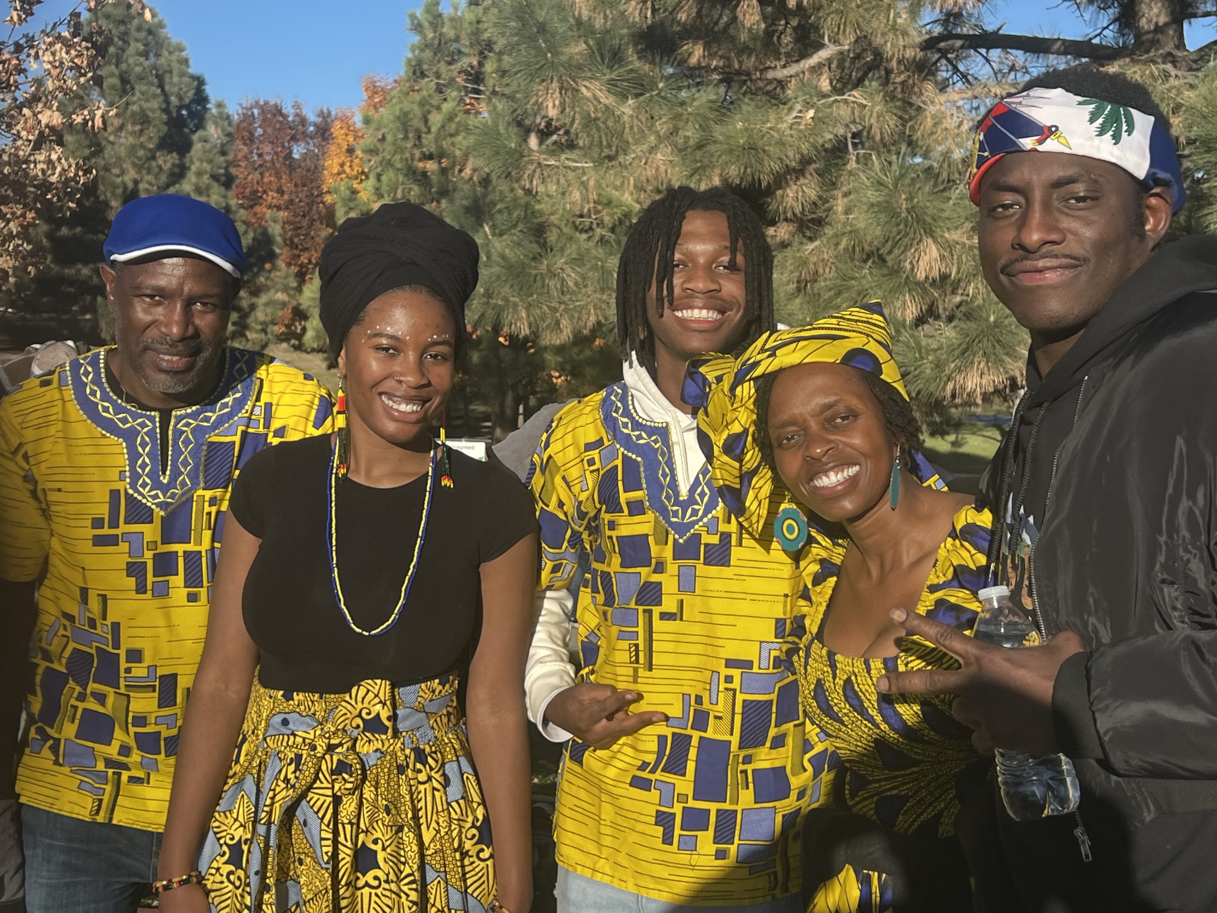 Community members in African attire at outdoor event